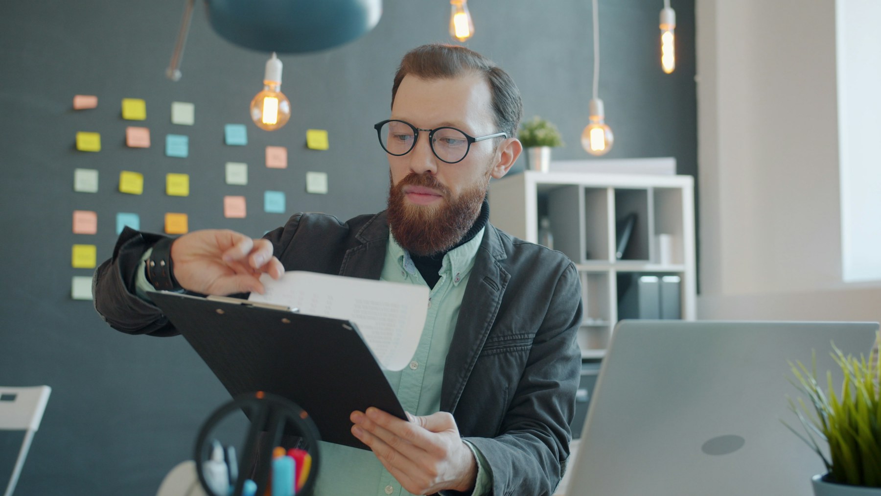 A reviewer examining program and financial materials